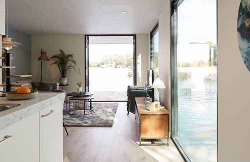 Maasbree House | Looking for a relaxing getaway close to the water? Then this vacation home located directly on a lak