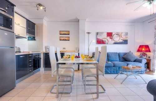 Arona Apartment | Prime 2-Bedroom Apartment Steps from the Beach, Rated 10/10