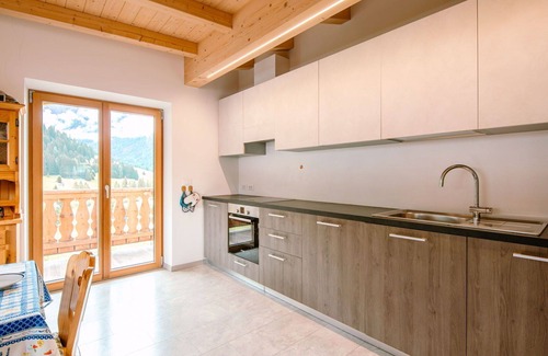San Giovanni di Fassa Apartment | Inviting Apartment for 8 with Pet-Friendly Amenities