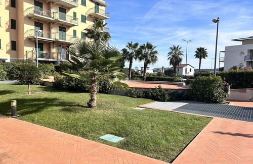 Imperia Apartment | Prime Apartment Steps from the Ocean with Pool & Views