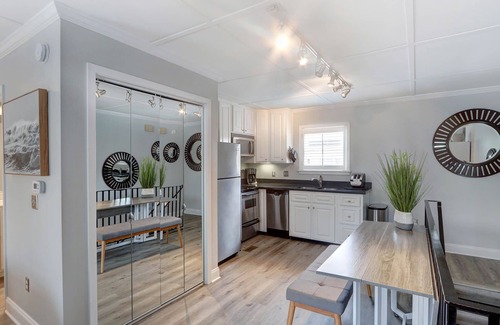 Hitch Village - Fred Wessels Homes Apartment | Charming Carriage House in Downtown with Heated Pool Access