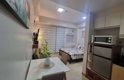 Iloilo Condo | Stylish Studio with Festive Walk Mall Views in City of Love