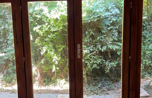 San Martino in Rio Cottage | Serene Wooden Retreat Nestled in Nature's Embrace