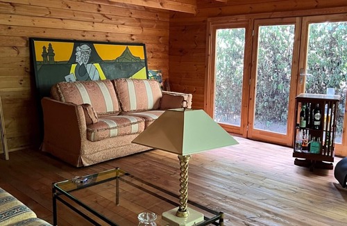 San Martino in Rio Cottage | Serene Wooden Retreat Nestled in Nature's Embrace