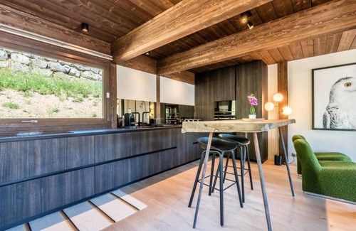La Cote-d'Arbroz Ski Chalet | Lovely wooden balconies, a swing chair with the most picturesque view