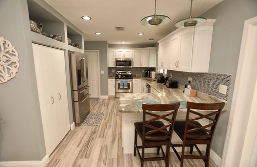 Bay Crest Park House | Experience Relaxation: 4BR Home with Heated Pool & Spa