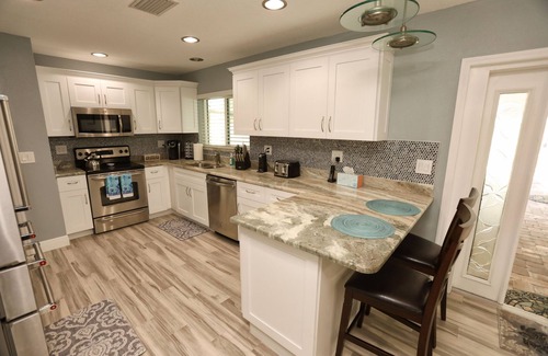 Bay Crest Park House | Experience Relaxation: 4BR Home with Heated Pool & Spa