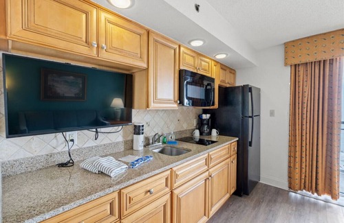Windy Hill Condo | Low Tide | Oceanfront Balcony | Kitchen | Pools