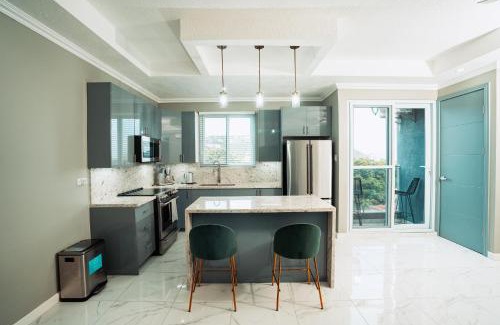 New Kingston Apartment | Elegant Rooftop Pool Retreat with Oceanfront Views