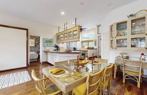 Woody Creek House | Lush tropical villa with garden paths, river views, and high-end comfort