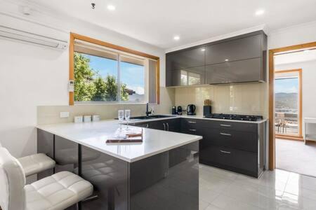 Lutana House | Family-Friendly Retreat at Lutana Large House, 4-Star Stay