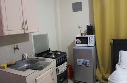 Mbotela Apartment | Cozy Suites at Attic Place: Studio Apartments with Kitchen
