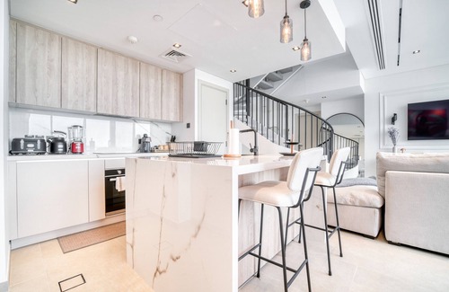 Bur Dubai Apartment | Modern Duplex Retreat in DIFC with Pool & Family Amenities