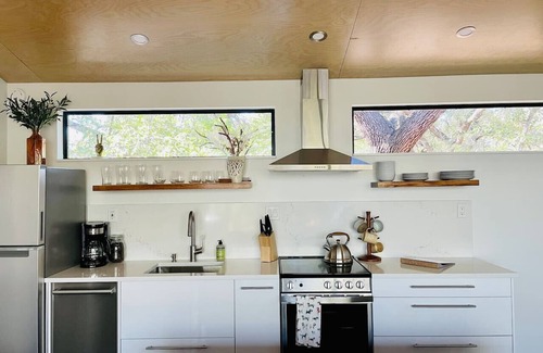 Dripping Springs Cabin | Modern Treehouse Escape with Pool and Firepit Amenities