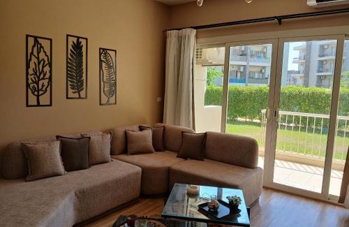 Sheikh Zayed City Apartment | Elegant Apartment with Private Garden & Pool Access