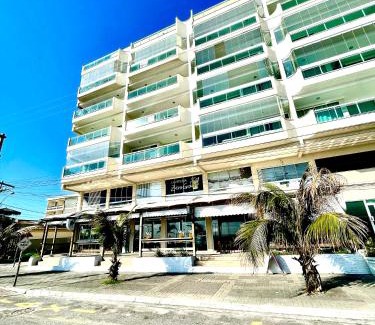 Praia Grande Apartment | Elegant Coastal Retreat with Pool and Oceanfront Views