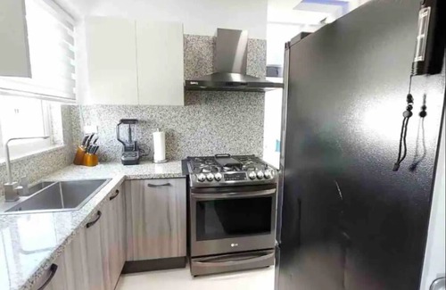 Ensanche Quisqueya House | Elegant 2BR Condo with Rooftop, Jacuzzi & Pet-Friendly Amenities