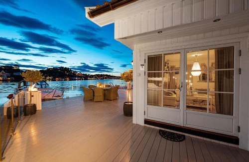 Arendal House | Elegant Boathouse with Private Dock and Oceanfront Views