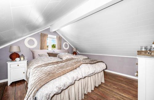Arendal House | Elegant Boathouse with Private Dock and Oceanfront Views