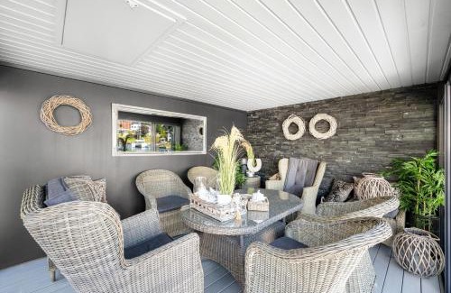 Arendal House | Elegant Boathouse with Private Dock and Oceanfront Views