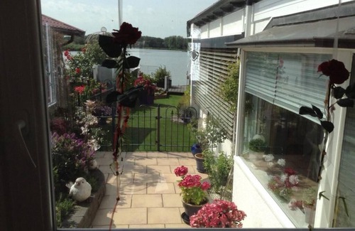 Onderdijk House | Tranquil Lakefront Home with Ocean Views and Family Amenities