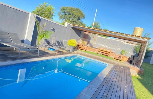 Bulawayo Apartment | Elegant Mangethe Suite - Relax by the Pool & Enjoy Breakfast