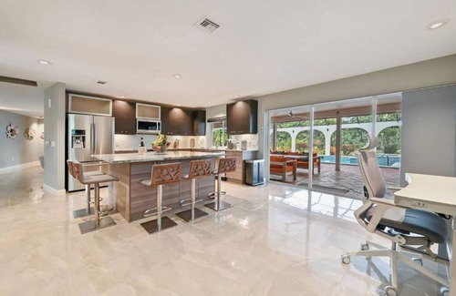 Palm River Estates House | Exceptional Naples Retreat with Heated Pool, Steps to Beach