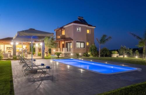 Malevizi Villa | Elegant Villa David: Oceanfront Bliss with Pool Access