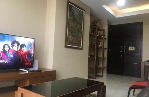 Karet Apartment | Elegant 2 BR Suite at The Grove with Pool & Dining Options