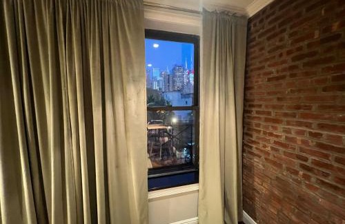Hell's Kitchen Apartment | Stylish 1BD Retreat in Midtown West with Family Amenities