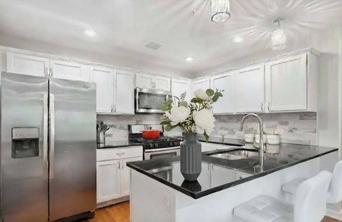 Lowry Hill East House | Luxury 4 Bed 5 Bath Penthouse with Rooftop Downtown Views