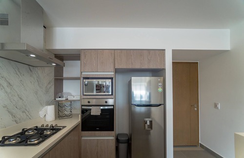 Zona Industrial Apartment | Stylish Apartment Tower Indico with Pool and Spa Amenities