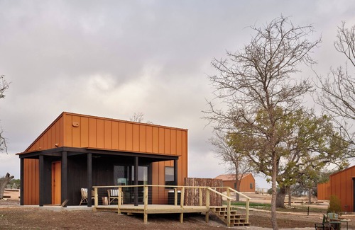 Stonewall Cabin | Luxury cabin in the center of the Texas Wine Country; large private porch w/hot tub, gas grill and fire pit; pet friendly