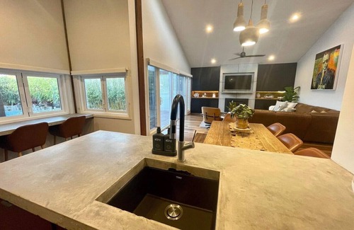 Patonga House | Beachfront Family Retreat with Heated Pool & Ocean Views