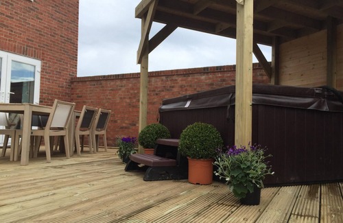 Seahouses House | Family Beach Retreat with Ocean View & Hot Tub, Rated 9.8