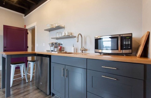 Dundee Apartment | Elegant Fireplace Suite in Modern Loft with Ocean View
