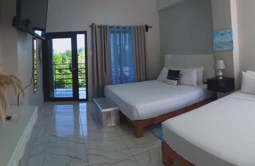 Port Antonio Hotel | Luxury havens with two kings or a king and queen bed, overlooking Port Antonio