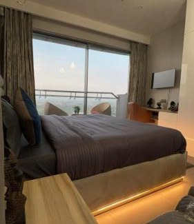 Noida Apartment | Stunning Heights: City & River Views with Pool Access