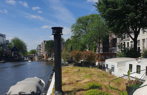 Nieuwmarkt en Lastage Boat Rental | Exceptional Houseboat in Amsterdam Center with Pool & Breakfast