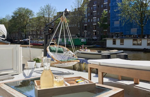 Nieuwmarkt en Lastage Boat Rental | Exceptional Houseboat in Amsterdam Center with Pool & Breakfast