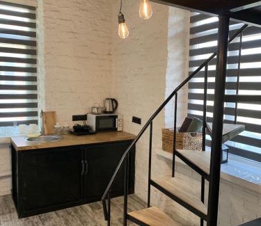 Kamenets-Podol'skiy Apartment | Stylish Loft Retreat: Pet-Friendly with Hot Tub & 9/10 Rating