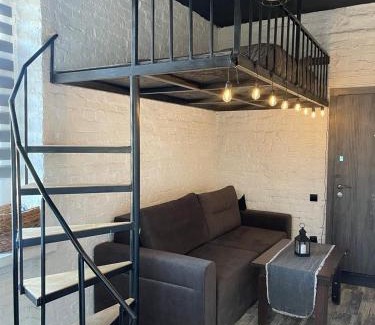 Kamenets-Podol'skiy Apartment | Stylish Loft Retreat: Pet-Friendly with Hot Tub & 9/10 Rating
