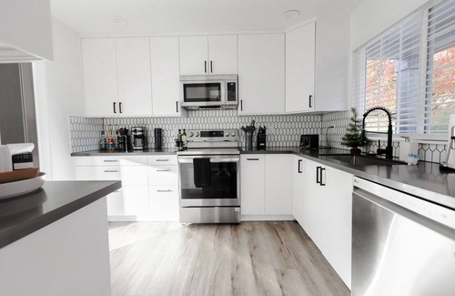 Four Corners House | Modern King Suite for Families & Business Travelers
