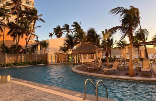 Zona Dorada Apartment | Oceanfront Relaxation at Camino al Mar with Heated Pool