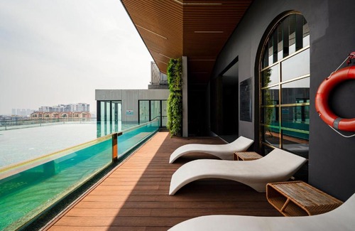 District 1 Apartment | Indulge at D1mension: 4-Star Retreat with Hot Tub & More