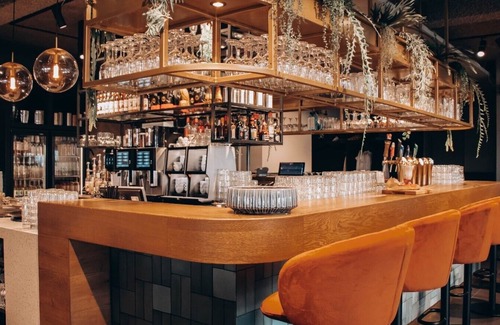 Municipality of West Maas en Waal Hotel | Luxury room with a balcony overlooking De Gouden Ham, offering modern amenities and a serene, picturesque setting.