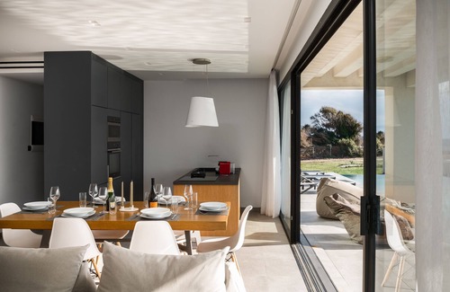 Chalikounas Villa | Seafront Villa Afroditi: Private Beach & Heated Pool Oasis