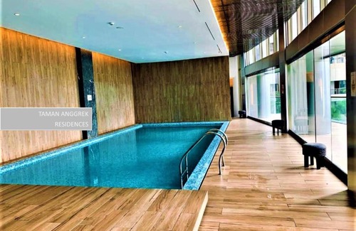 Jakarta Apartment | Modern Studio at Taman Anggrek with Pool & Child-Friendly Amenities