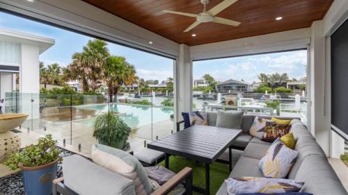 Moreton Bay Region House | Elegant Retreat on the Canal with Pool & Family Amenities