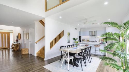 Moreton Bay Region House | Elegant Retreat on the Canal with Pool & Family Amenities